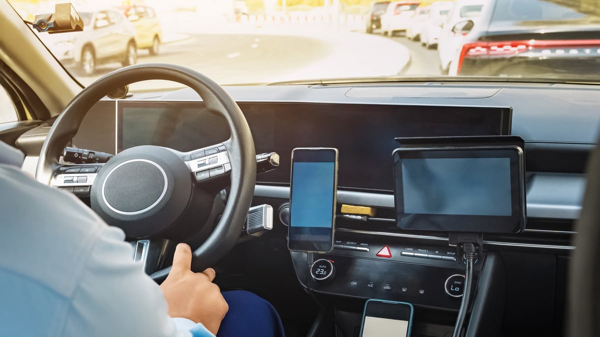 Taxi driver following a GPS route through a busy city
